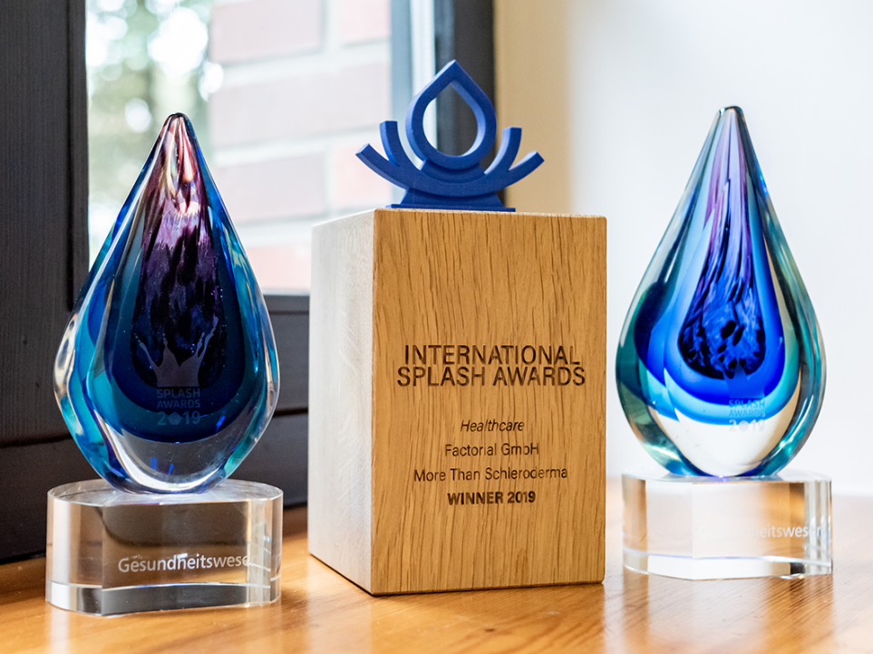 Image showing twe Splash Awards trophies that Factorial won in previous Splash Awards' editions