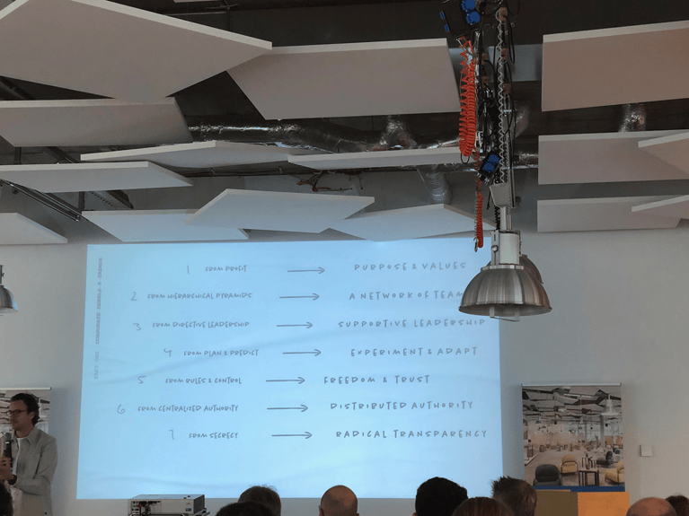 Image showing keynote with title: How to make radically decentralized organizations work by Pim de Morree / Corporate Rebels