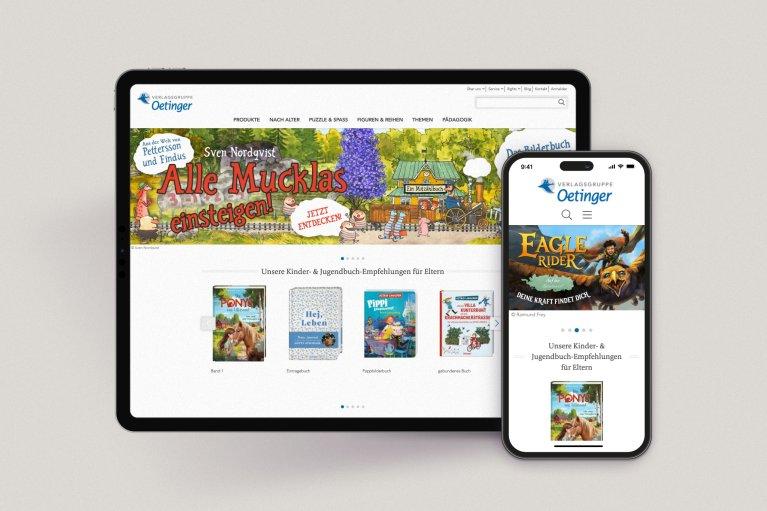 Website des Oetinger Verlags auf einem Tablet und einem Smartphone Display.